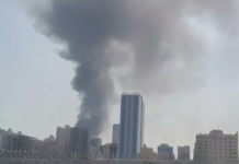 Konfrontasi AS-Iran: Teheran Balas Serang Pangkalan di Bahrain dan Kuwait Personel penyelamat dan penanggulangan sipil Bahrain memeriksa puing bangunan di Muharraq yang rusak akibat serangan drone Iran.